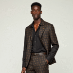 Model wearing Chi & Stainless tailored menswear in Ankara and cotton